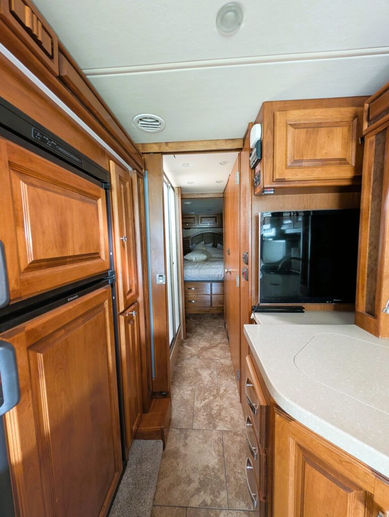 2013 Tiffin Allegro Breeze 32BR diesel pusher for sale – galley to bedroom